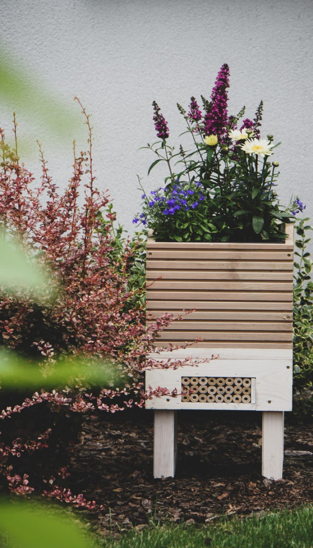 Flower pot with a shelter for insects